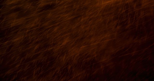Abstract image showing fire sparks flying through a dark night sky, creating a dynamic pattern. Ideal for backgrounds, digital textures, art projects, or representing themes of fire, warmth, energy, and motion.