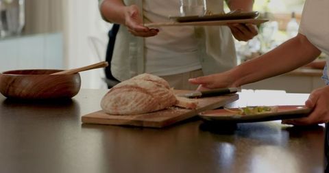Friends Enjoying Homemade Bread in Casual Dining Setting