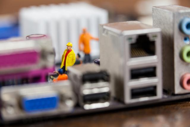 Miniature Workers Repairing Computer Motherboard - Download Free Stock Photos Pikwizard.com