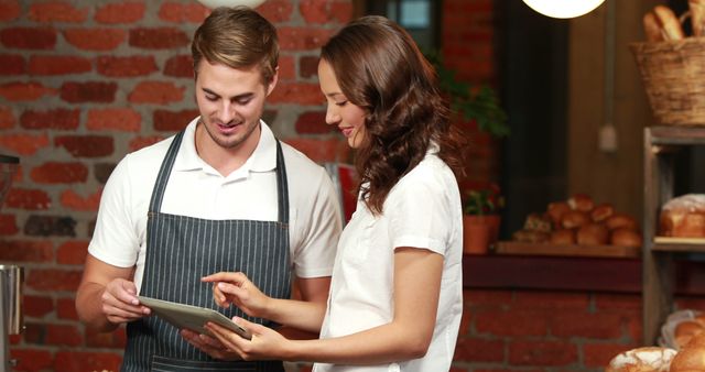 Bakery Employees Using Digital Tablet in Industrial Kitchen - Download Free Stock Images Pikwizard.com