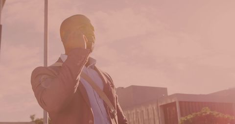 Confident Businessman Communicating on Cell Phone Outdoors