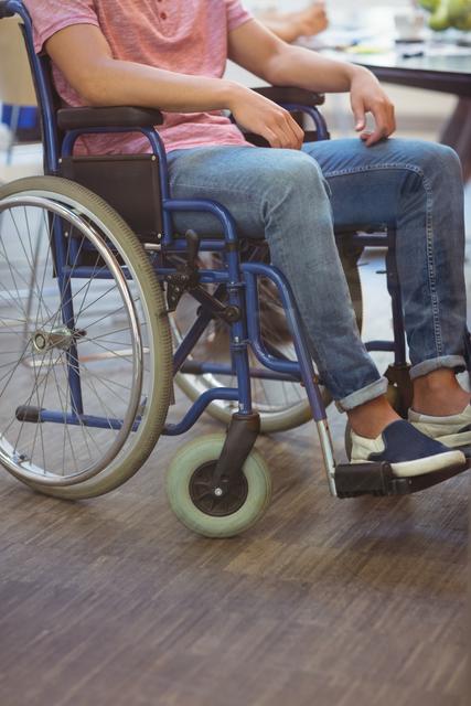 Close-up of handicapped business executive sitting in wheel chair