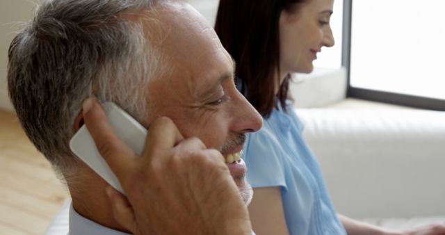 Mature Businessman Talking on Smartphone Indoors - Download Free Stock Images Pikwizard.com