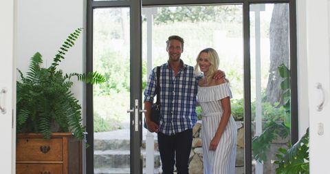 Happy Couple Entering Home with Smiles