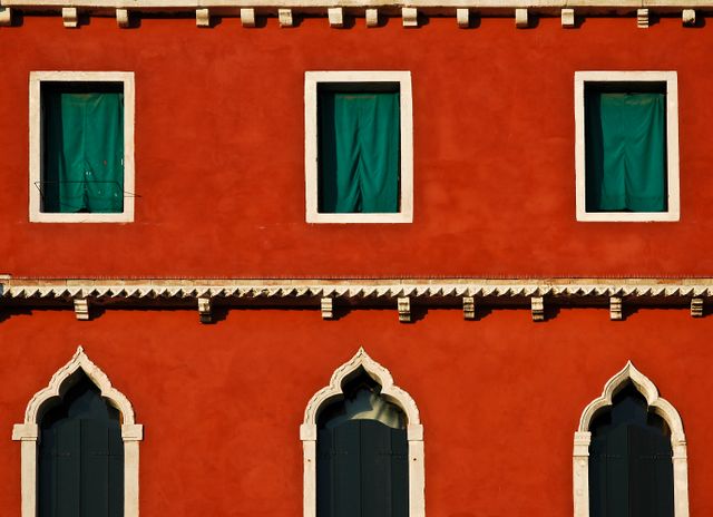 Colorful Red Venetian Building Facade with Green Windows - Download Free Stock Images Pikwizard.com