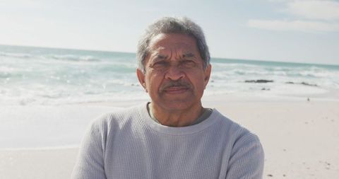 Confident Hispanic Senior Man Standing on Serene Beach - Download Free Stock Images Pikwizard.com