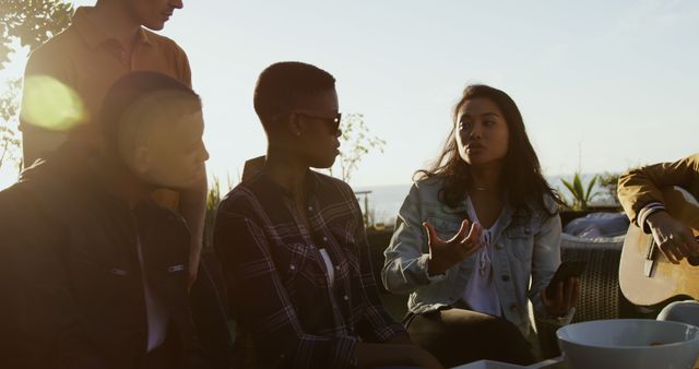 Friends Having a Lively Discussion Outdoors - Download Free Stock Images Pikwizard.com