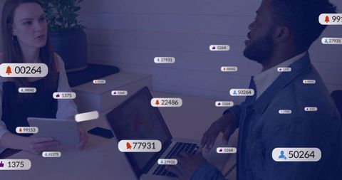 Digital collaboration meeting with laptop and tablet showing social media analytics badges