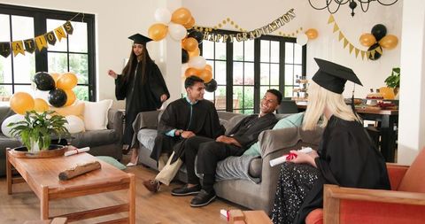 Graduation Celebration with Multiracial Friends in Merry Living Room