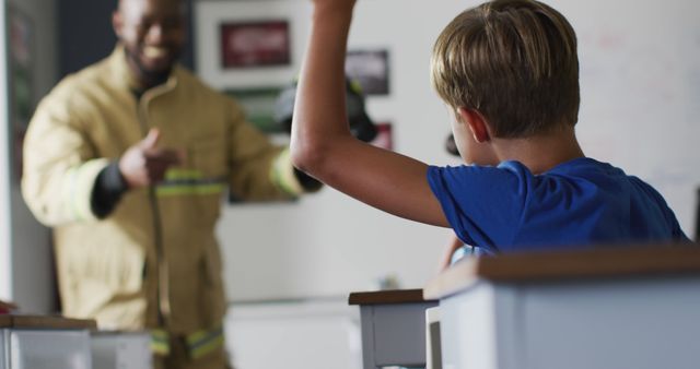 Firefighter Engaging with Excited Children in Classroom Session - Download Free Stock Images Pikwizard.com