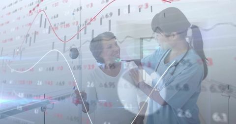 Healthcare Professional Supports Elderly Amidst Medical Data Charts