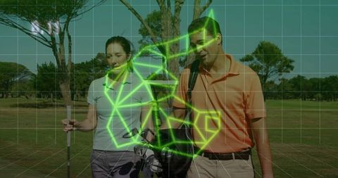 Mature Golfing Couple Walking on Fairway with Gear