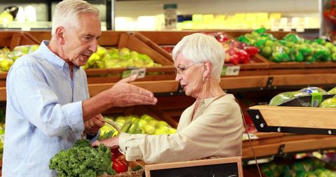 Senior Couple Enjoys Shopping for Fresh Groceries Together