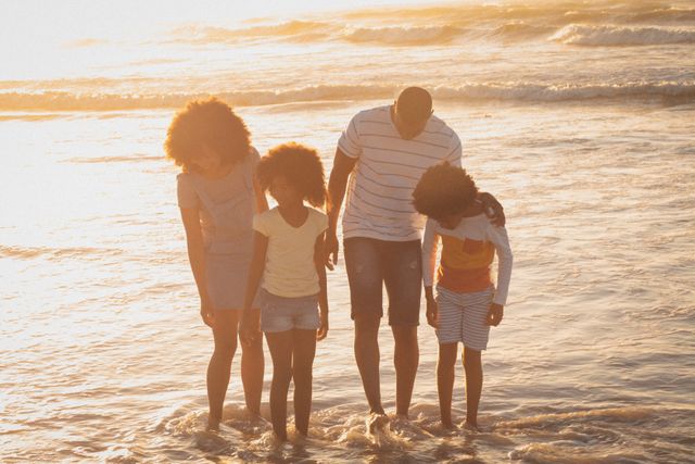 Happy African American Family Enjoying Beach Vacation at Sunset - Download Free Stock Photos Pikwizard.com