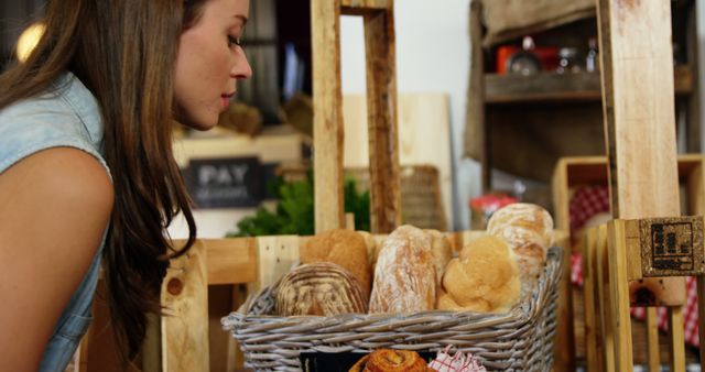 Woman Browsing Fresh Bread Display at Farmers Market - Download Free Stock Images Pikwizard.com