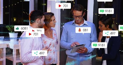 Team Reviewing Social Media Dashboard on Tablet at Night, Collaborating on Analytics