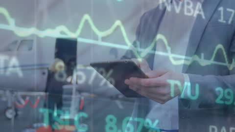 Businessman Using Tablet for Analyzing Financial Data at Airport