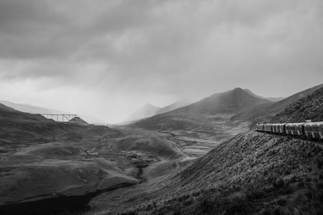 Black and White Landscape with Train Passing Through Mountains - Download Free Stock Photos Pikwizard.com