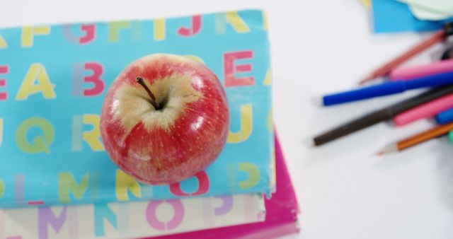 Red Apple on Colorful Books and Assorted School Supplies - Download Free Stock Images Pikwizard.com