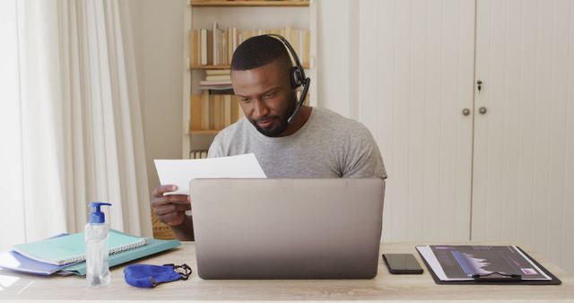 Young African American Man Working from Home with Headset and Laptop - Download Free Stock Images Pikwizard.com