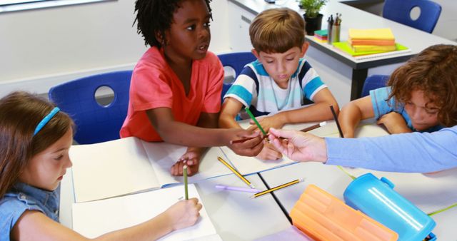 Diverse Group of Children Sharing Supplies in Classroom - Download Free Stock Images Pikwizard.com