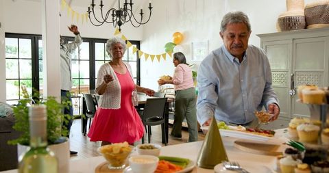 Senior Friends Celebrating Birthday at Home Party