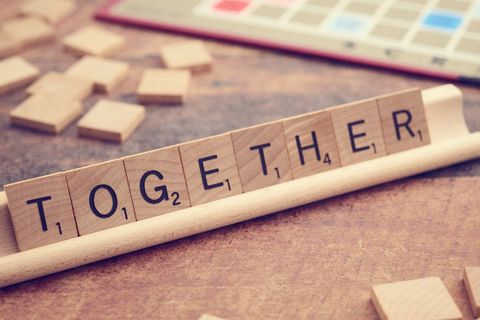 Scrabble Letters Forming 'Together' on Wooden Board