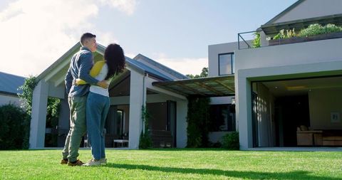 Happy Couple Enjoying Moment Outside Modern Home Together