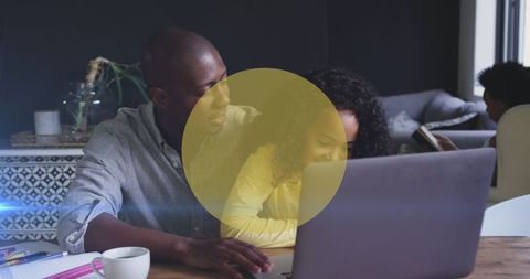 African American Father and Daughter Using Laptop Together