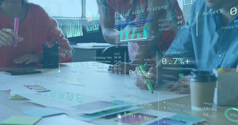 Colleagues analyzing digital financial data with infographics