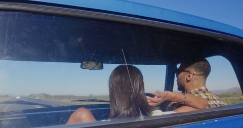 Couple Enjoying Scenic Road Trip in Vintage Car