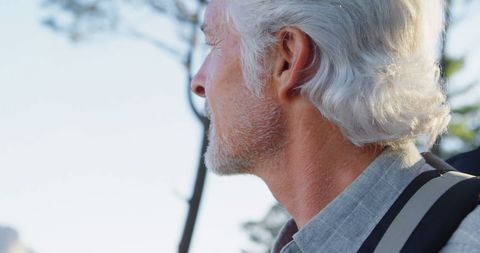 Elderly Man Backpacking in Sunlit Mountains - Download Free Stock Images Pikwizard.com