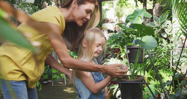 Mother and Daughter Enjoying Time in Garden Center - Download Free Stock Images Pikwizard.com