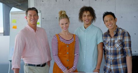 Diverse Business Team Smiling Together in Modern Office