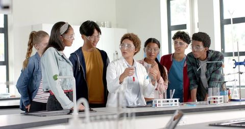 High School Students Engaged in Chemistry Experiment with Teacher - Download Free Stock Images Pikwizard.com