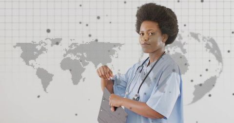 Confident african american nurse standing with clipboard wearing stethoscope and world map