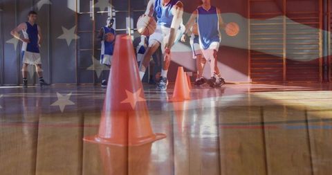 Youth players dribbling cone drill with american flag overlay for patriotic sports