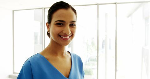 Confident Surgeon Smiling In Well-Lit Hospital Ward - Download Free Stock Images Pikwizard.com