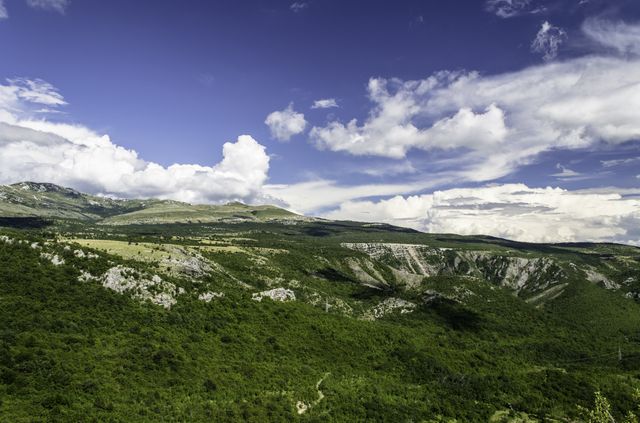 Vast Green Mountain Landscape Under Sunny Blue Sky - Download Free Stock Photos Pikwizard.com