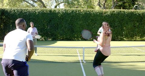 Diverse Friends Enjoying Outdoor Tennis Match
