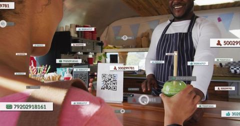 Barista handing green smoothie over qr-code payment counter at rustic market kiosk