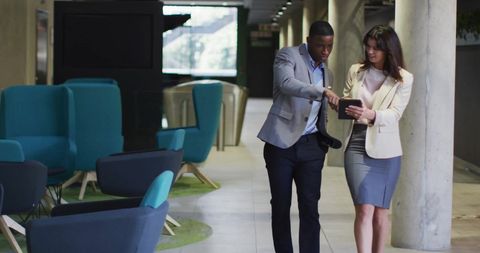 Professional Meeting in Modern Office Corridor