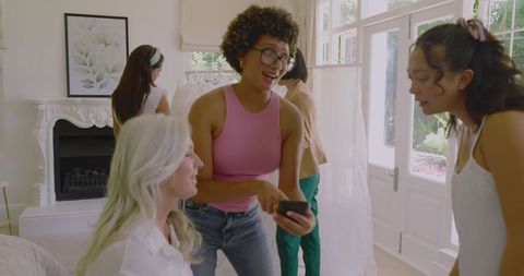 Bridesmaids Preparing in Bedroom for Joyful Wedding Celebration