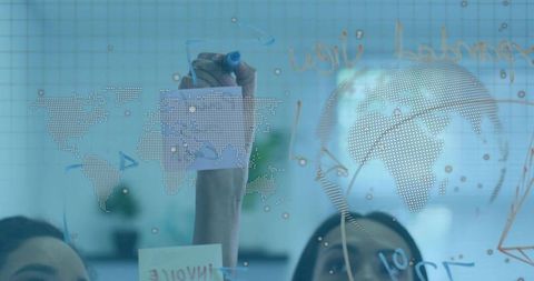 Collaborating on glass whiteboard drawing dotted world map for global strategy planning