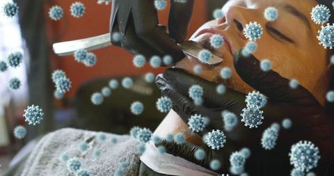 Barber providing grooming with enhanced safety measures and hygiene