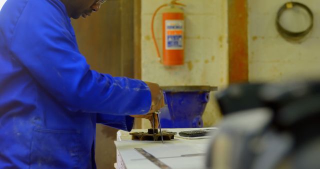 African Factory Worker Inspecting Materials in Workshop - Download Free Stock Images Pikwizard.com