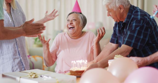 Joyous Senior Celebrating Birthday with Friends and Cake - Download Free Stock Images Pikwizard.com