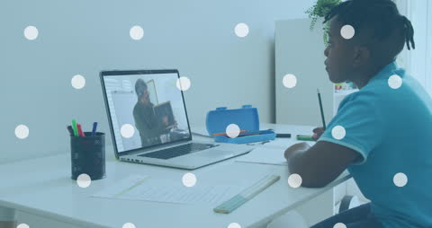 Boy Engaged in Online Class with Teacher