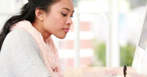 Biracial Woman Staying Focused in Modern Office Environment - Download Free Stock Images Pikwizard.com