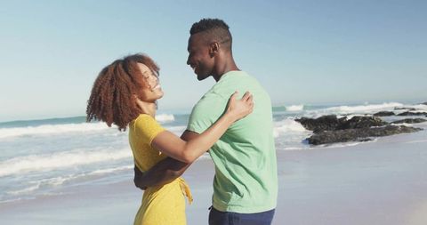 Romantic Beach Embrace: Couple Enjoying Ocean Views Together